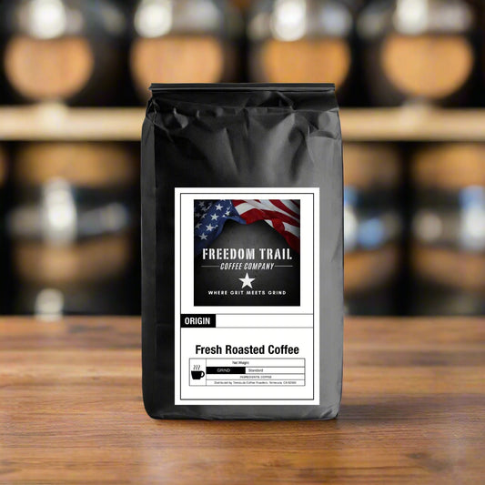 Black coffee bag with 'Freedom Trail Coffee Company' label on a white background