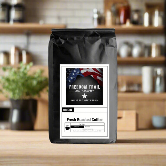 Black coffee bag with 'Freedom Trail Coffee Company' label on a white background